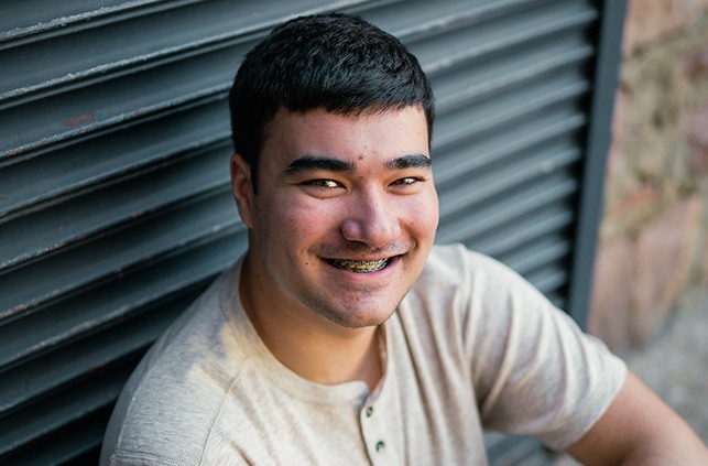 Smiling man with traditional braces