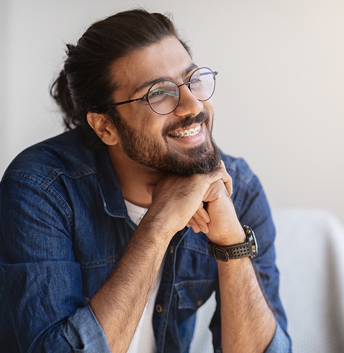 Smiling man with adult orthodontics