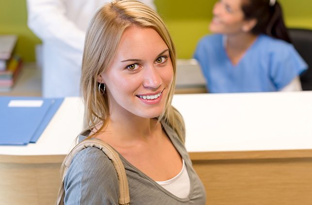 Woman sharing flawless smile after orthodontic treatment