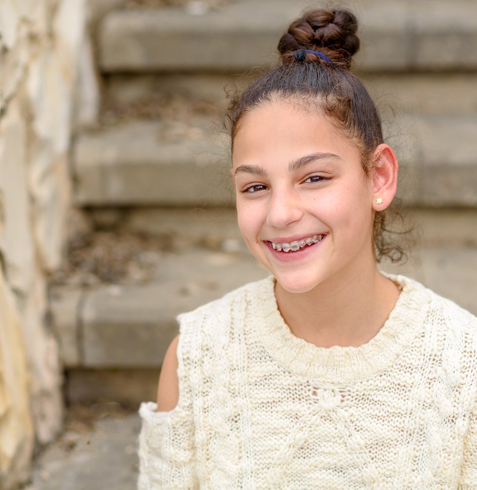 Girl smiling after seeing Medicaid orthodontist in Worcester