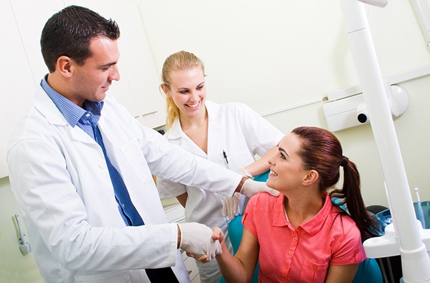 patient talking to dentist about orthodontic emergency in Worcester