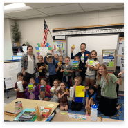 Orthodontic team members and children in classroom