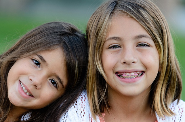 Two young girls receiving dentofacial orthopedic treatment