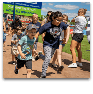 Kids running the bases at baseball event