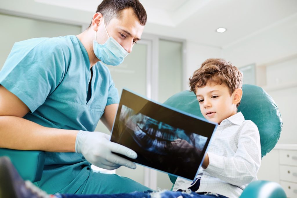 Orthodontist in Worcester showing child their X-rays