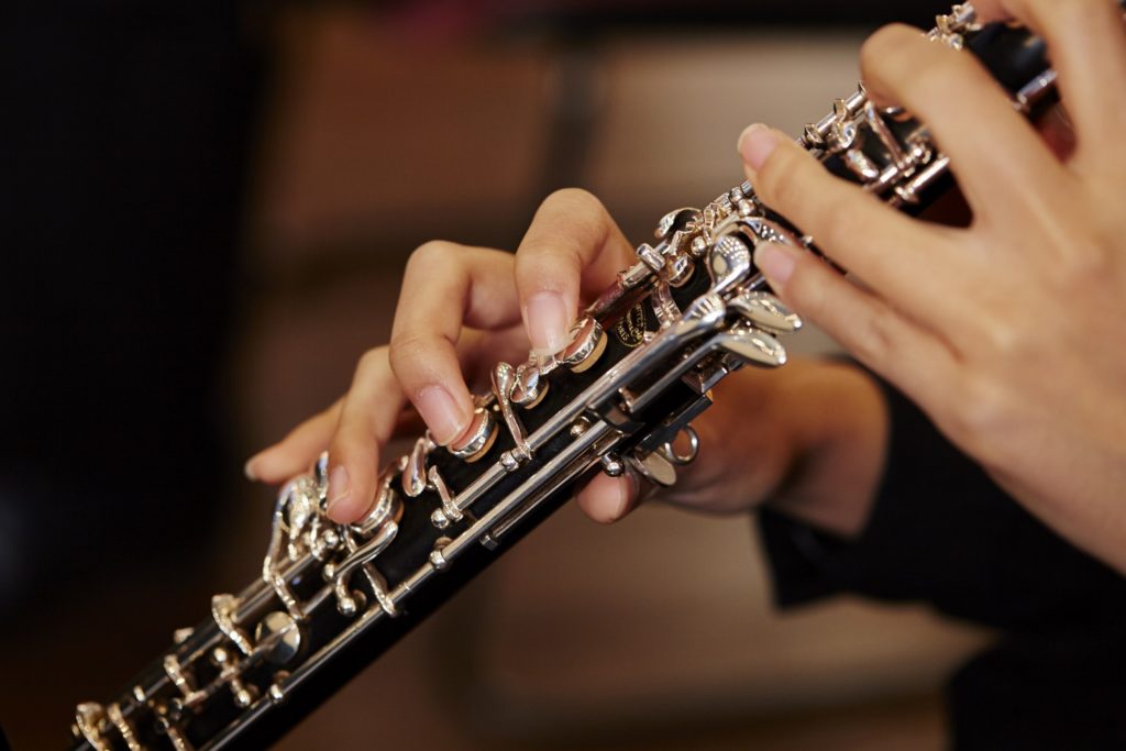 Closeup of child playing saxophone