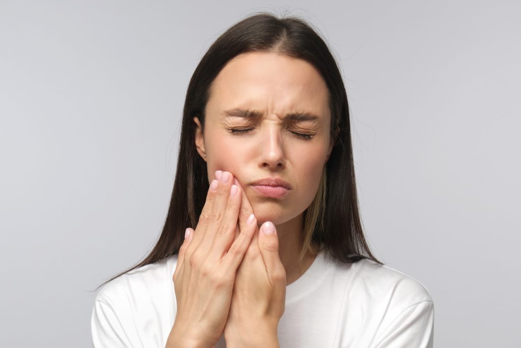 Closeup of woman struggling with mouth sores