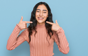 a person smiling with braces