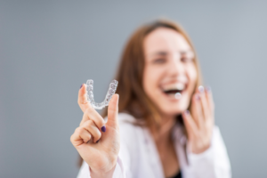 a patient with Invisalign smiling 